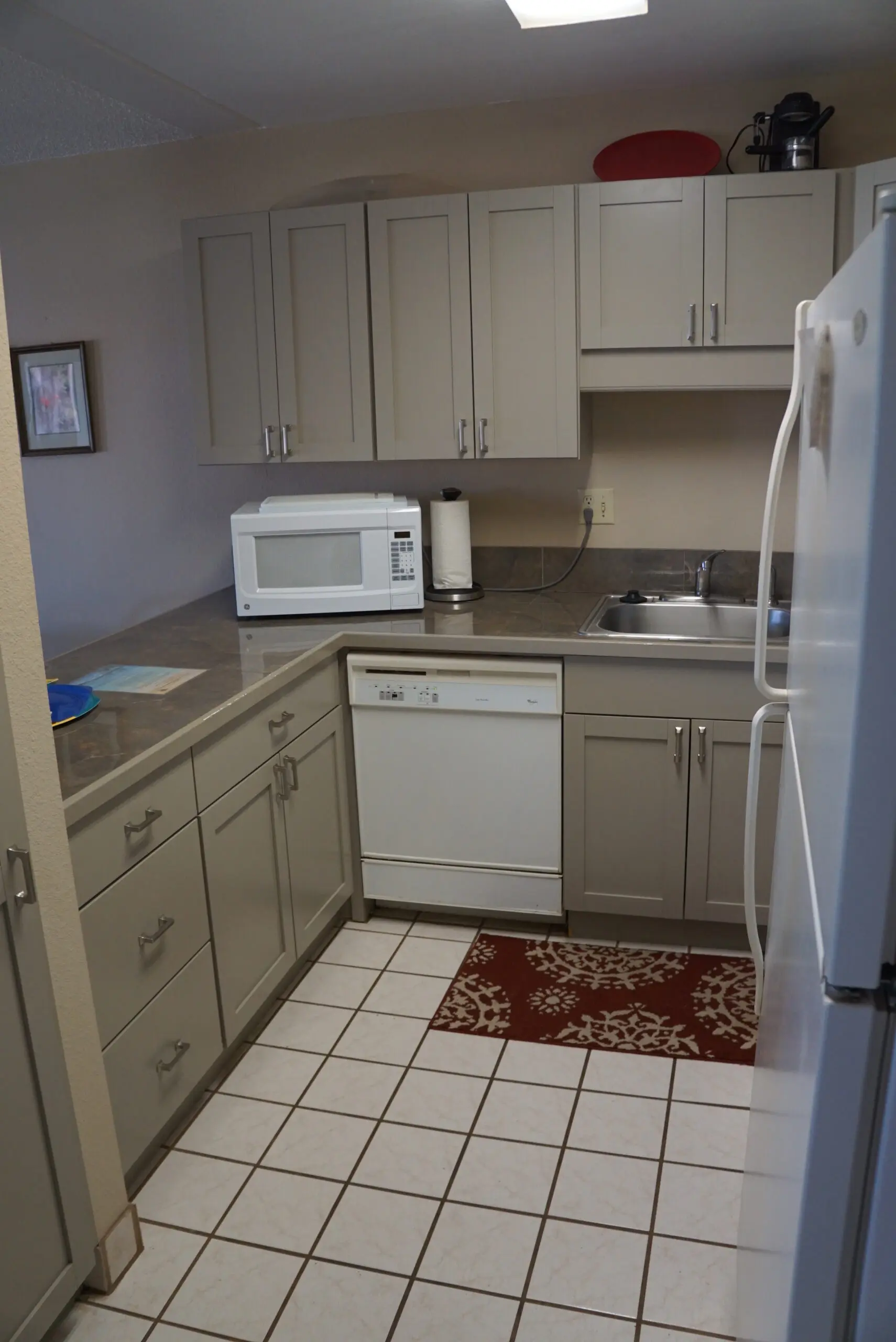 Modern kitchen with gray cabinets and appliances