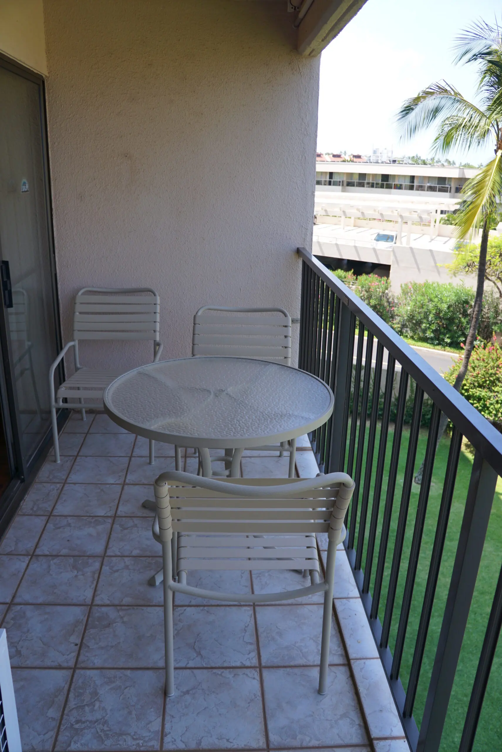 Outdoor balcony with table and chairs