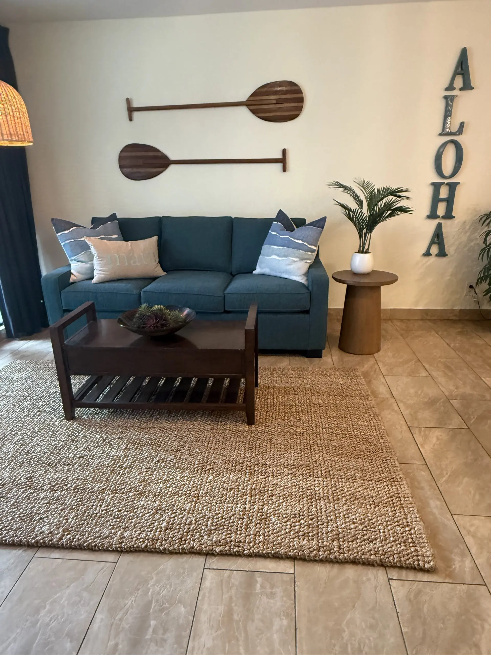 Cozy living room with teal sofa and decor